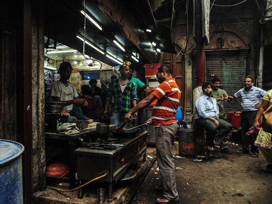 People in a narrow market passage