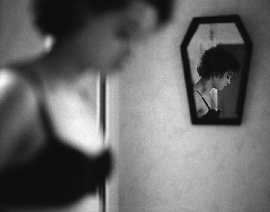 Woman and a mirror in a soft-focus portrait