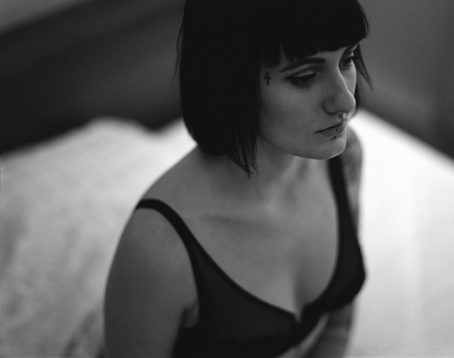 Woman with dark hair in a soft-focus portrait