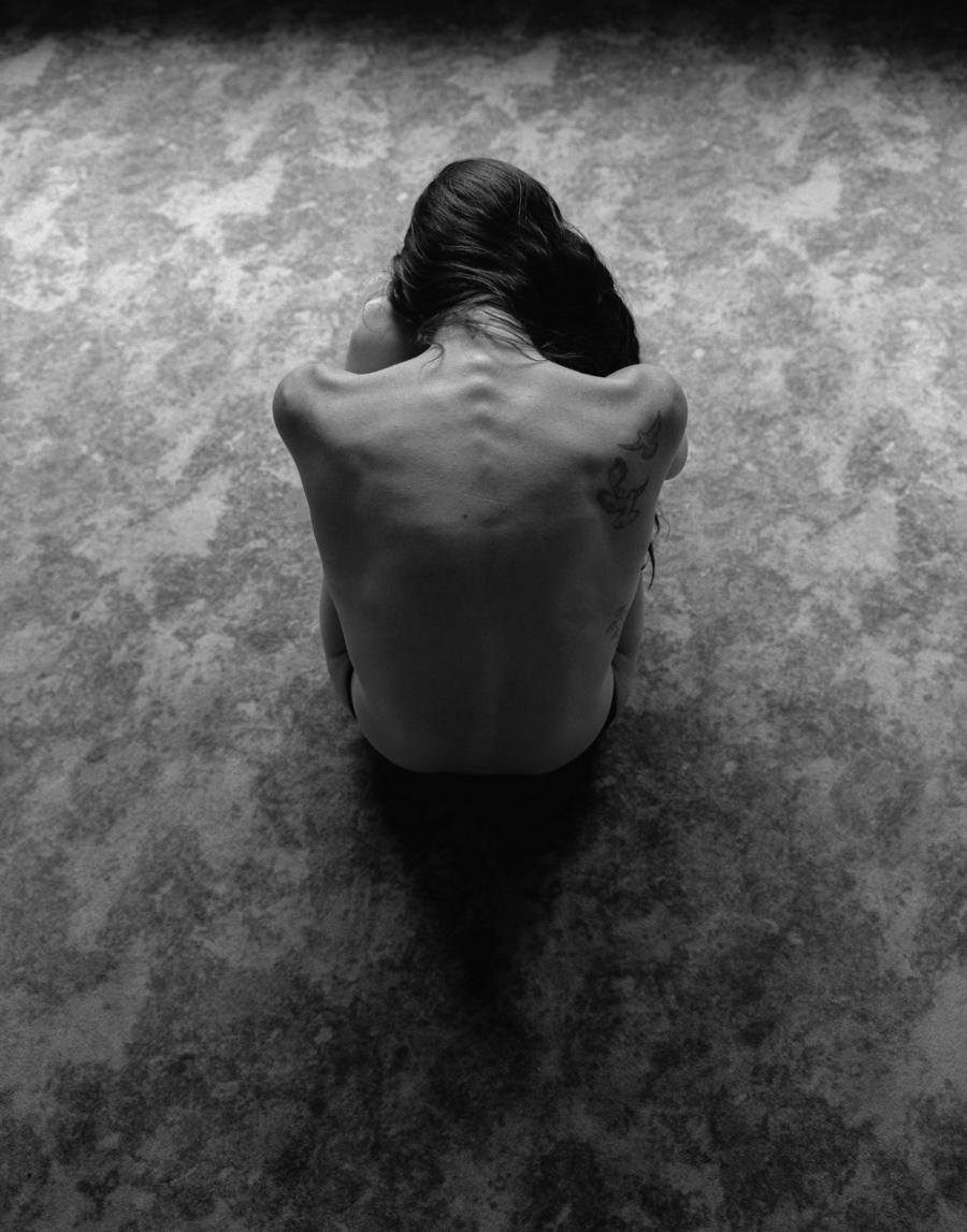 Person seen from behind in an outdoor portrait