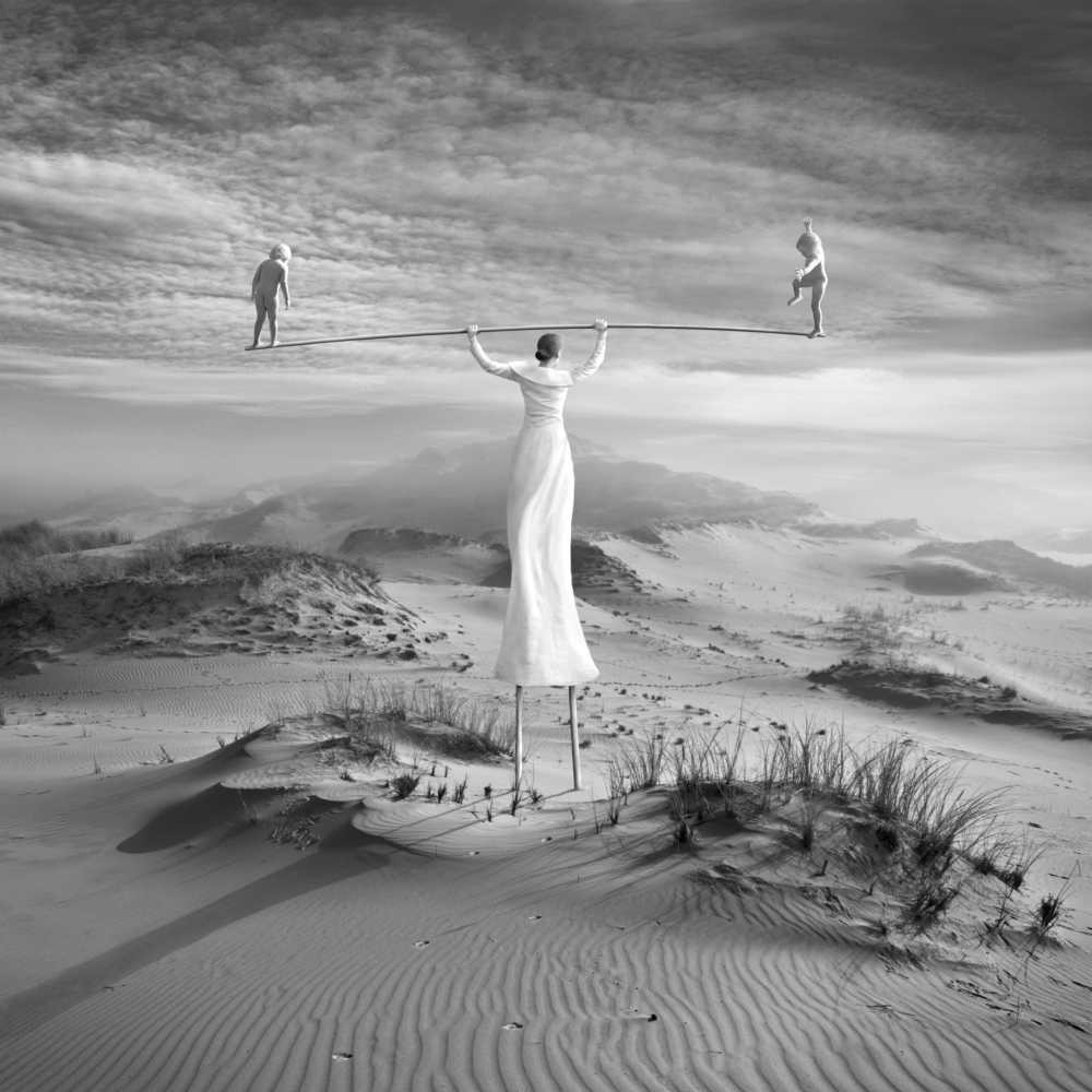 White figures in a surreal desert scene