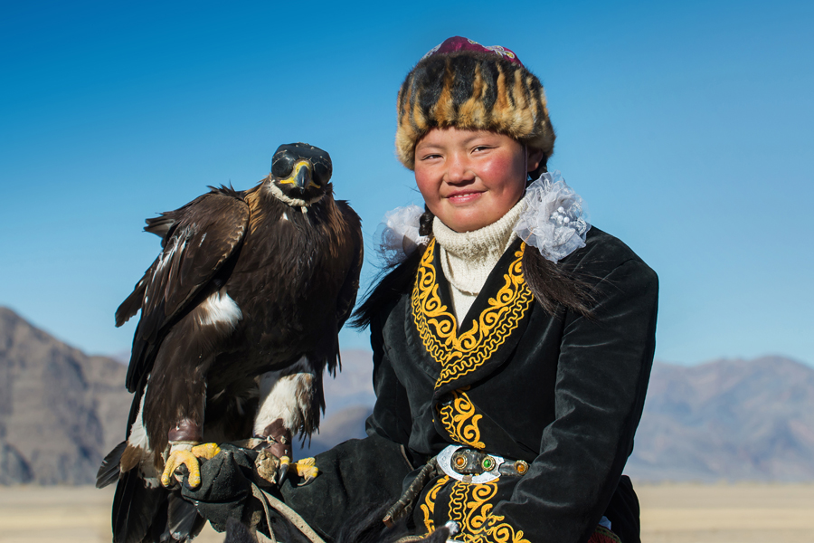 Portrait of a rider holding an eagle