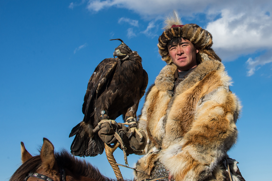 Rider in fur clothing holding an eagle