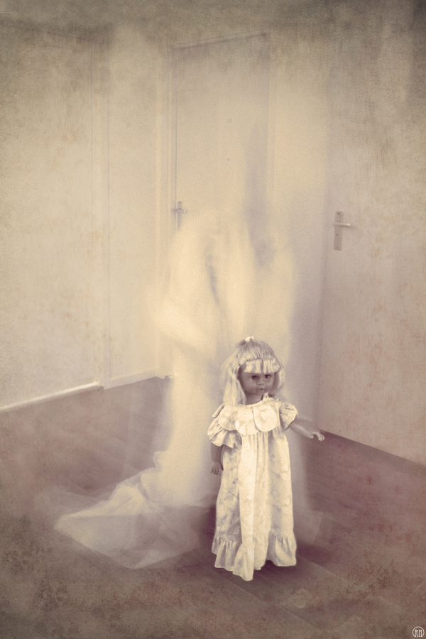 Doll sitting alone in an empty room
