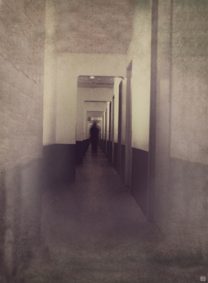 Dark figure at the end of a hallway