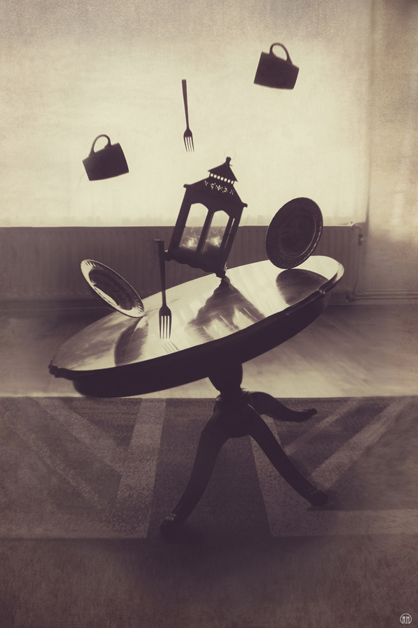 Chair suspended above a table