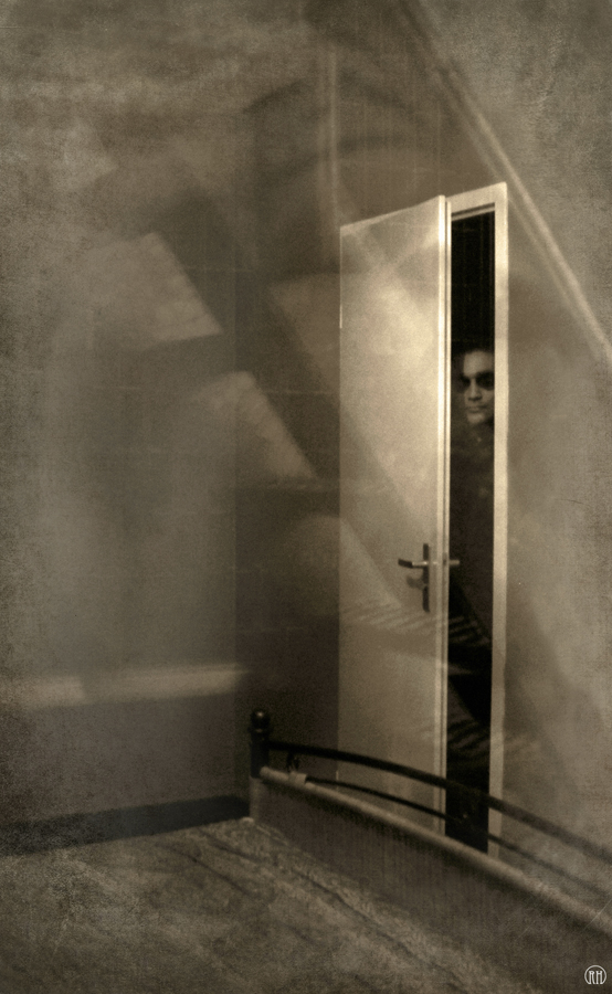 Shadow at the end of an open doorway