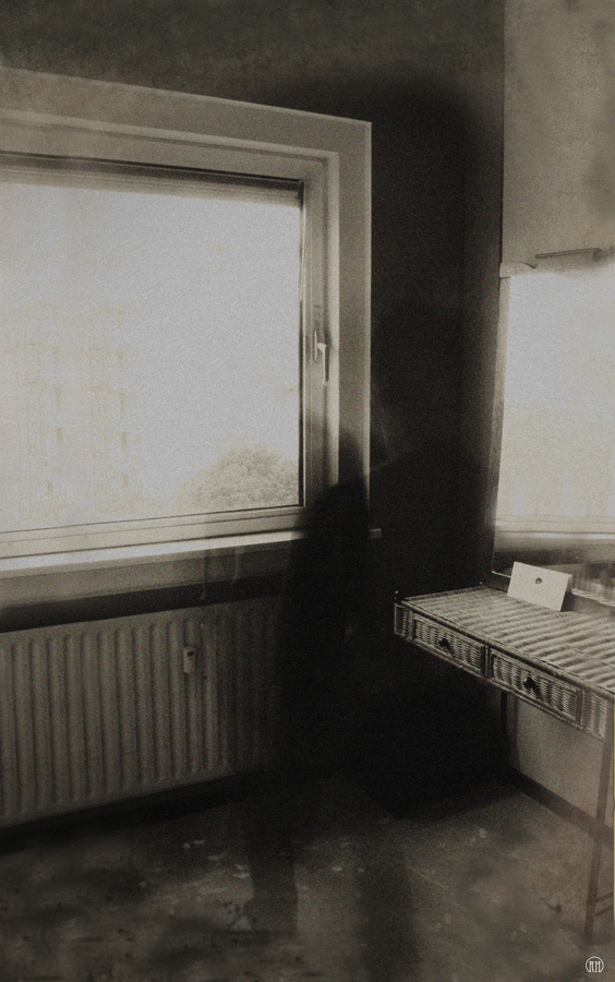 Dim figure by a window