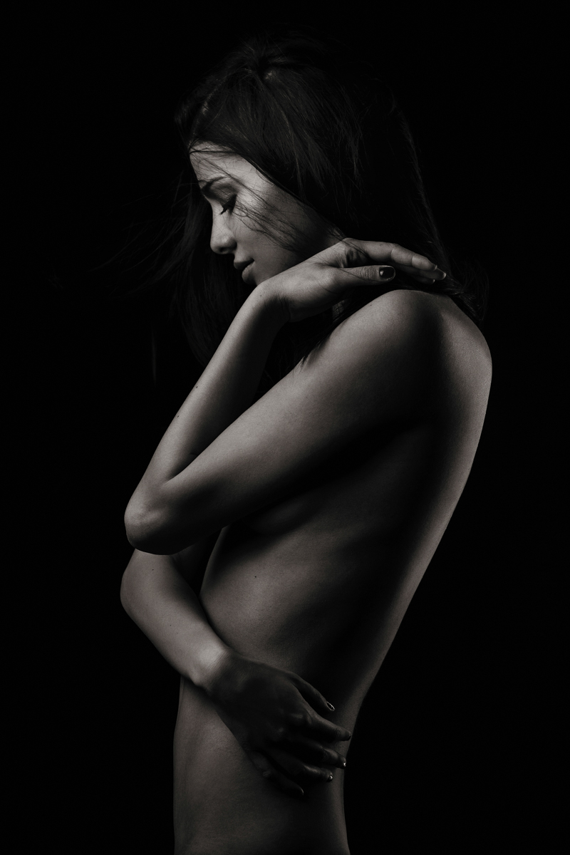 Woman resting her hand against her head