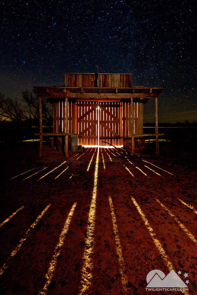 Bright light inside a small structure with radiating traces across the dark foreground