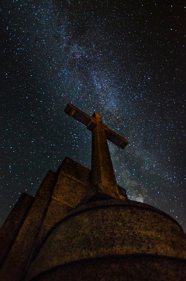 Milky Way over a stone cross monument - astrophotography by Joao Santos
