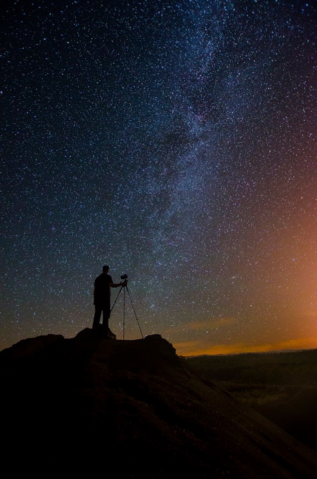 Silhouette of a photographer under the Milky Way - astrophotography by Joao Santos