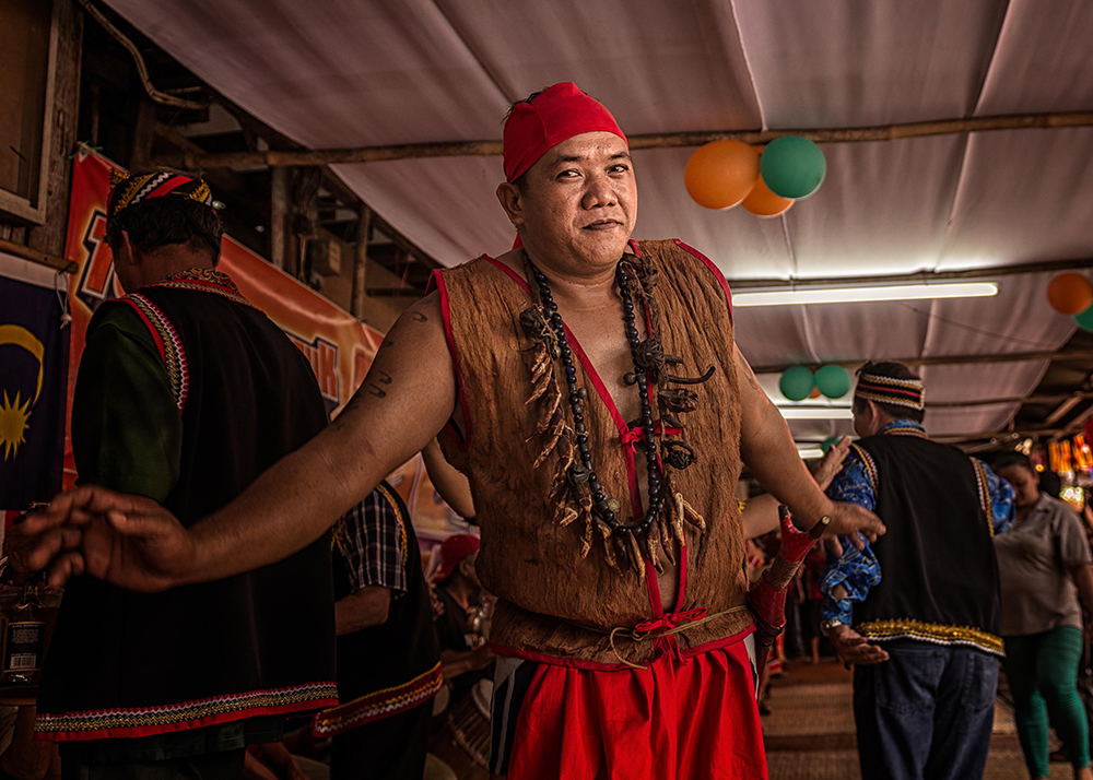 Bidayuh men in warrior dress dancing at Gawai - The Native of Sarawak by Edanan Taiban