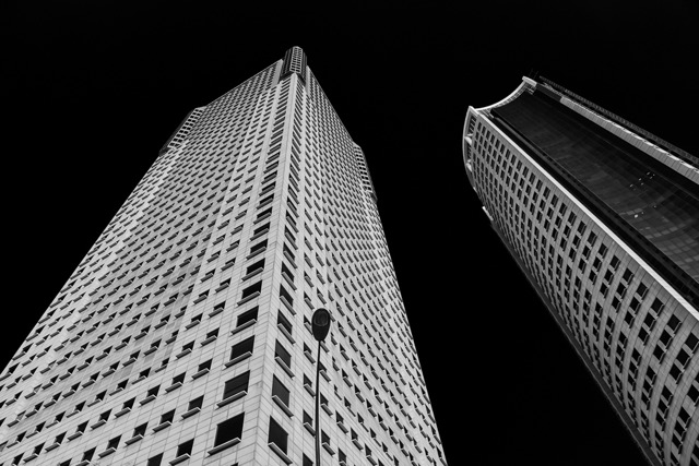 Twin white towers looking up, black and white - Contemporary Architecture in Singapore by Ravi Jambunathan