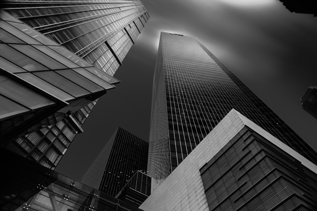 Looking up at glass skyscrapers, black and white - Contemporary Architecture in Singapore by Ravi Jambunathan