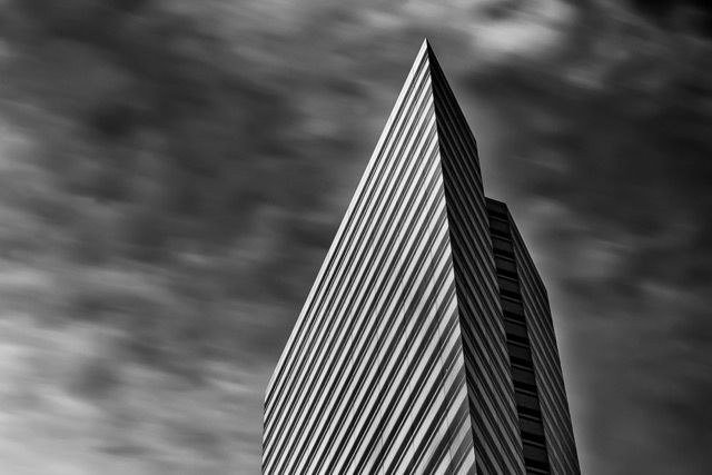 Striped tower against streaked clouds, black and white - Contemporary Architecture in Singapore by Ravi Jambunathan