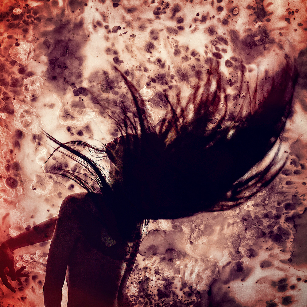 Silhouette of a woman with flying hair against red foliage - surreal photo by Cathryn Mok