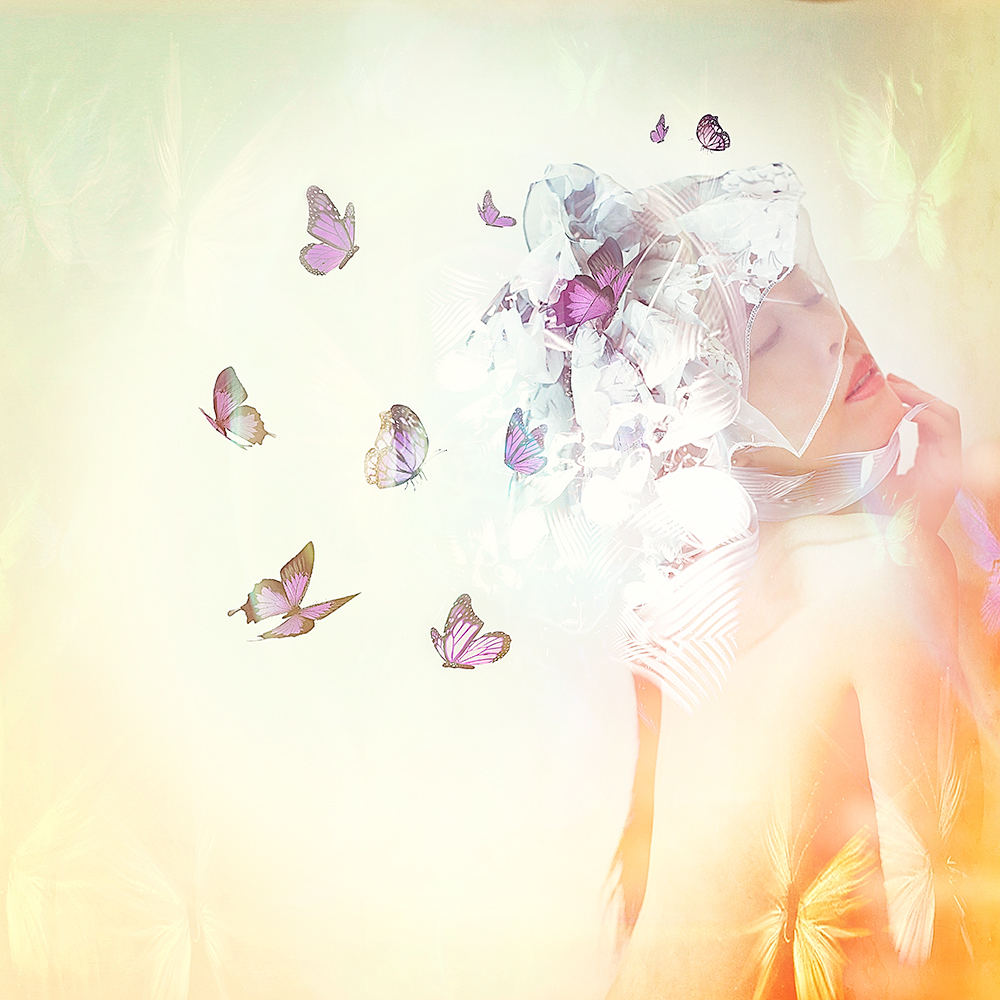 Woman surrounded by butterflies and flowers in warm light - surreal photo by Cathryn Mok