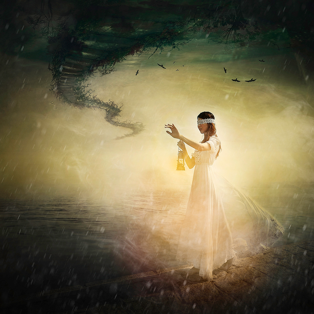 Woman in a golden misty woodland path - surreal photo by Cathryn Mok