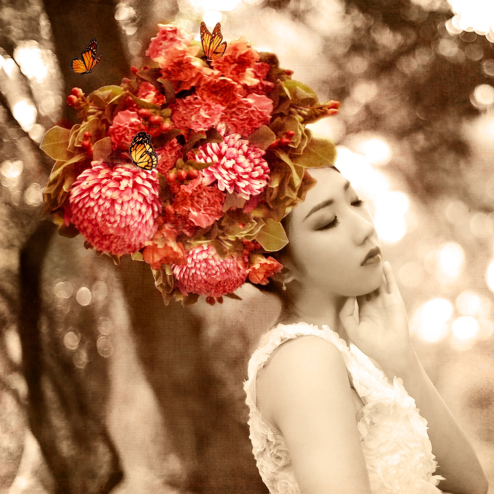 Woman wearing a giant red flower headpiece - surreal photo by Cathryn Mok