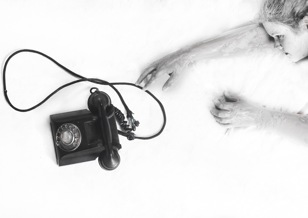 Porcelain figure reaching toward a black rotary telephone - Fading away, depression series by Cheree Smith