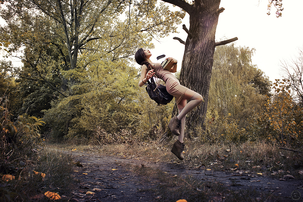 Levitating girl reading a book in a forest - Perspective Matters by Contagious Reverie