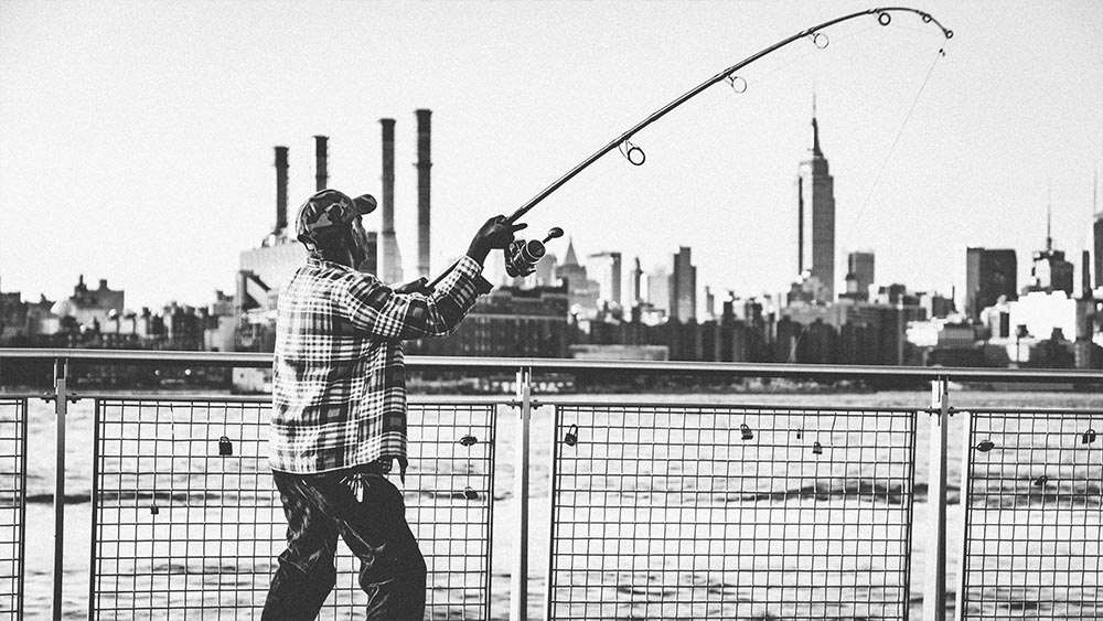 Fisherman casting with the Empire State Building behind him - New Yorkers by Lebrvn Creations