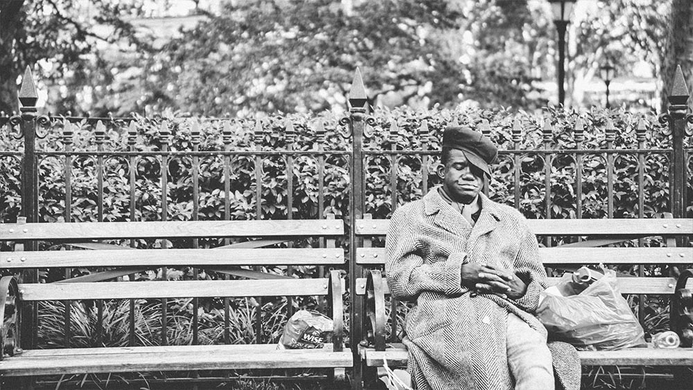 Man reading a newspaper on a park bench - New Yorkers by Lebrvn Creations