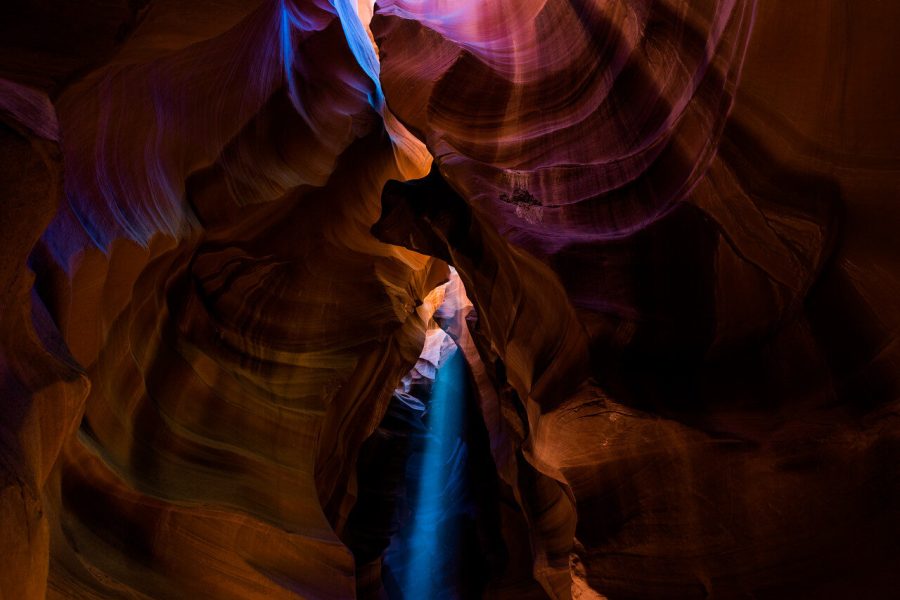 Light entering layered sandstone walls in Antelope Canyon