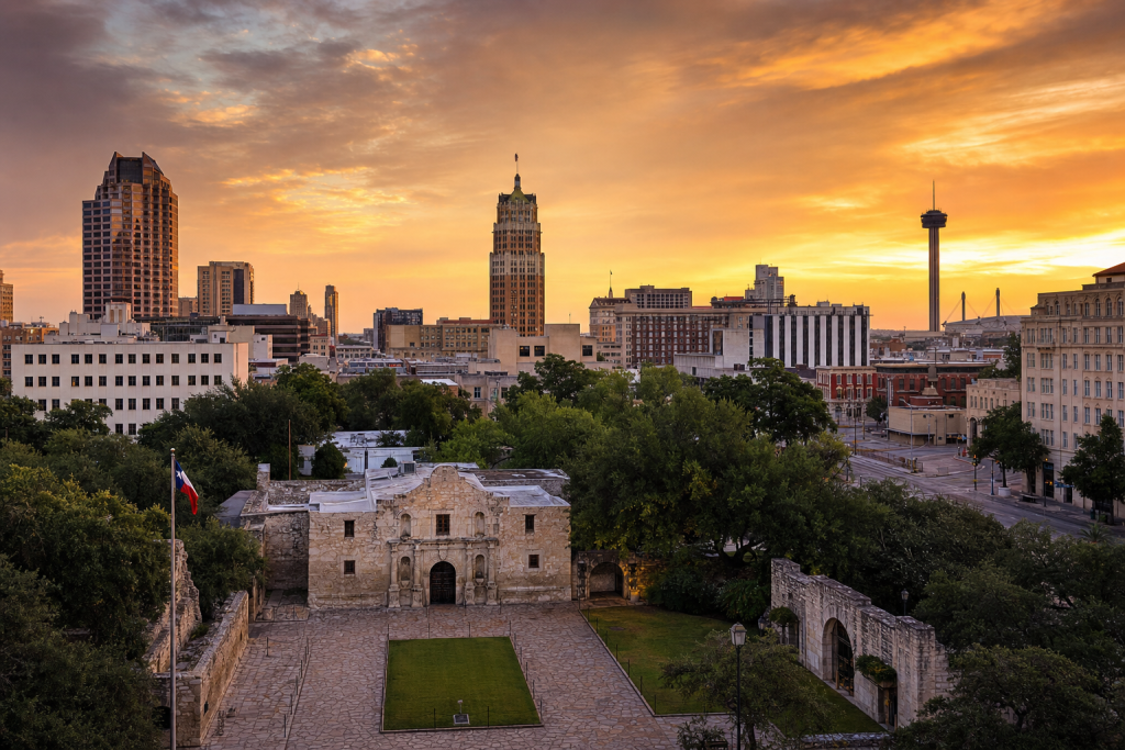 Wide-angle cinematic skyline of San Antonio at golden hour, iconic landmarks visible, dramatic warm light