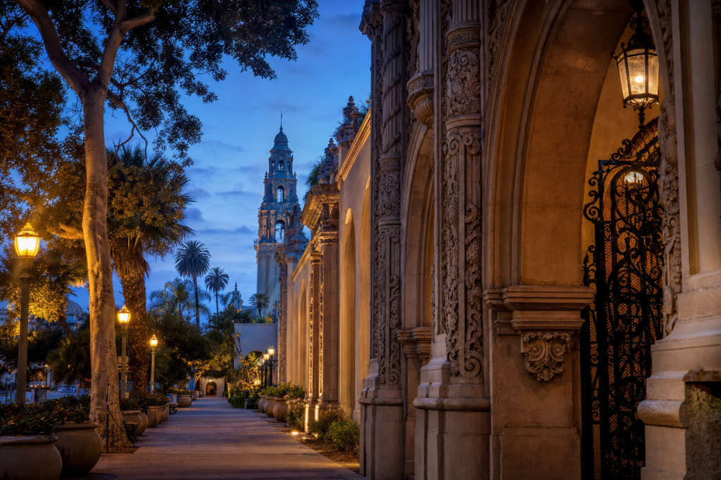 Street-level perspective in San Diego, leading lines, architectural detail, blue hour with mixed ambient and street lighting