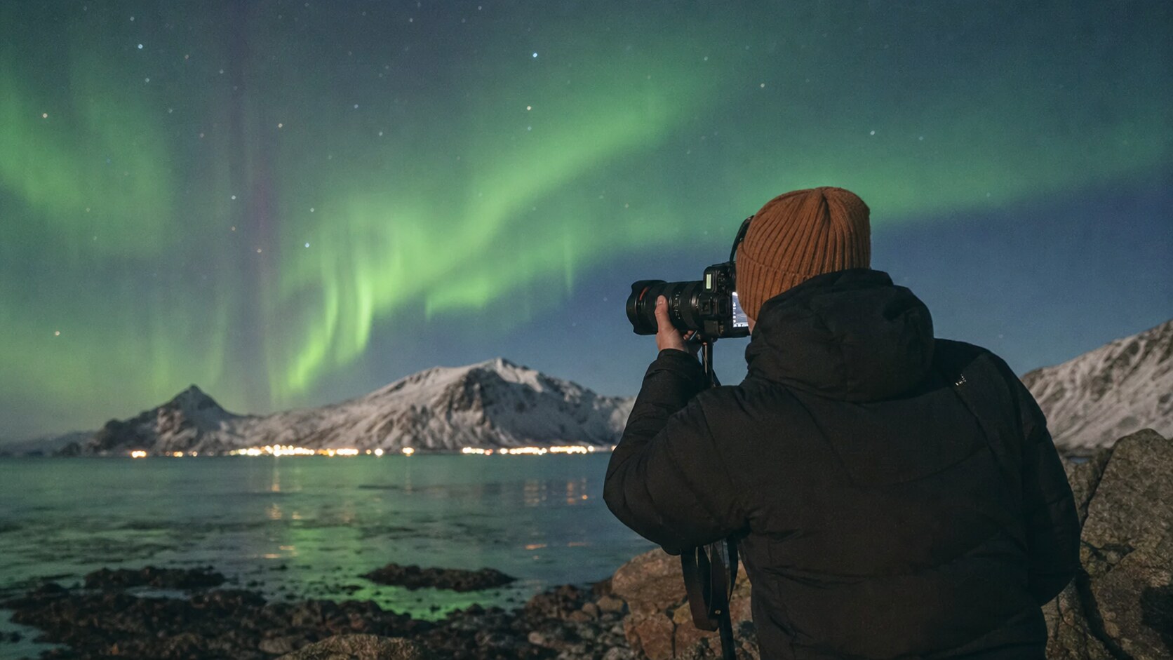 Lifestyle photograph of a photographer working with subject related to Best Northern Lights Photography Tours