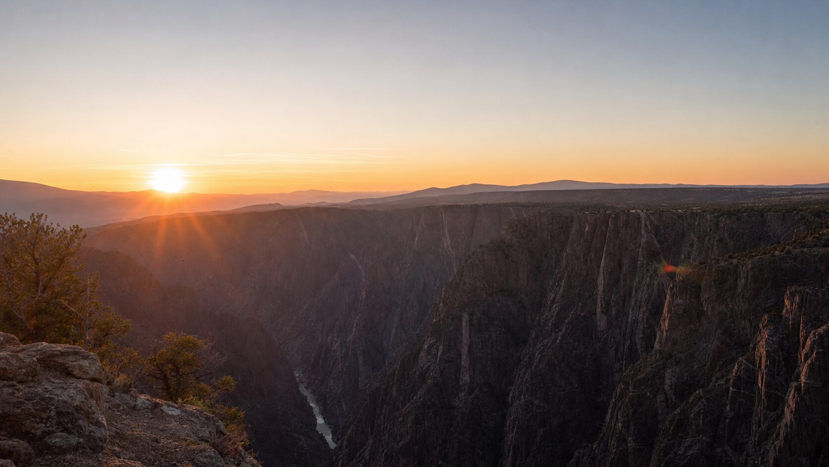 Black Canyon Of The Gunnison skyline at sunset, photographed from the city's best-known public viewpoint — a top spot for photography in Black Canyon Of The Gunnison
