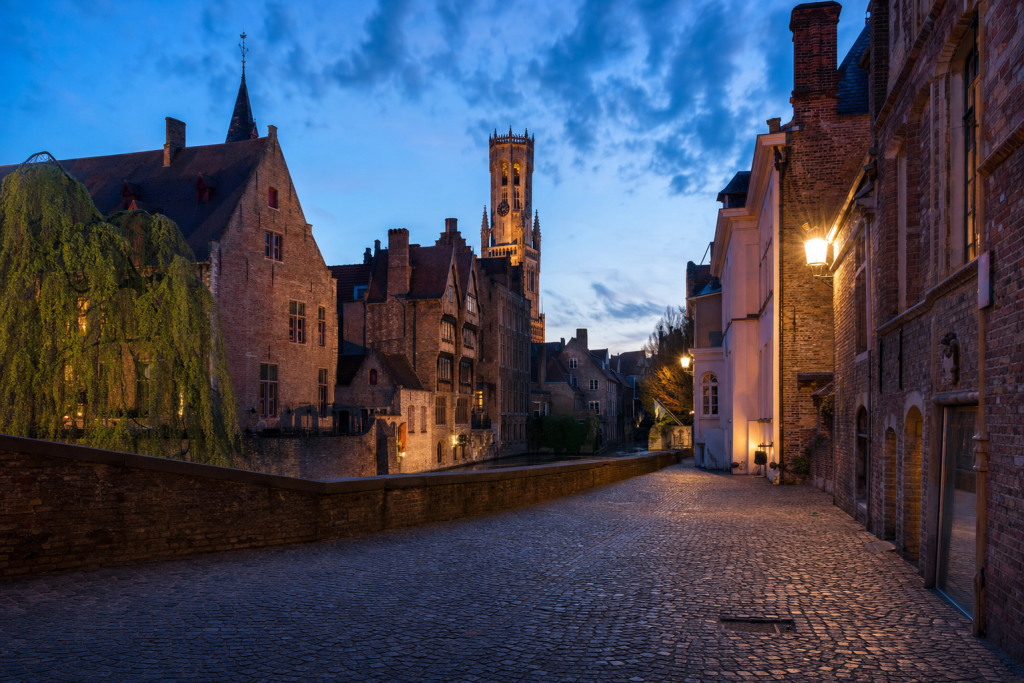 Bruges street photography at blue hour with leading lines and architectural detail