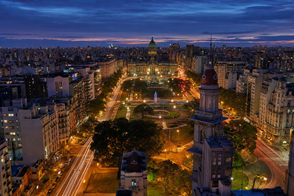Buenos Aires high-vantage cityscape at blue hour with city lights and traffic motion