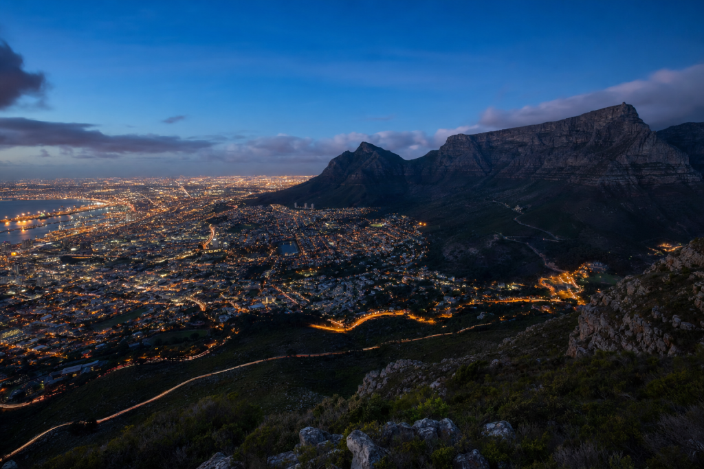 Cape Town high-vantage cityscape at blue hour with city lights and traffic motion