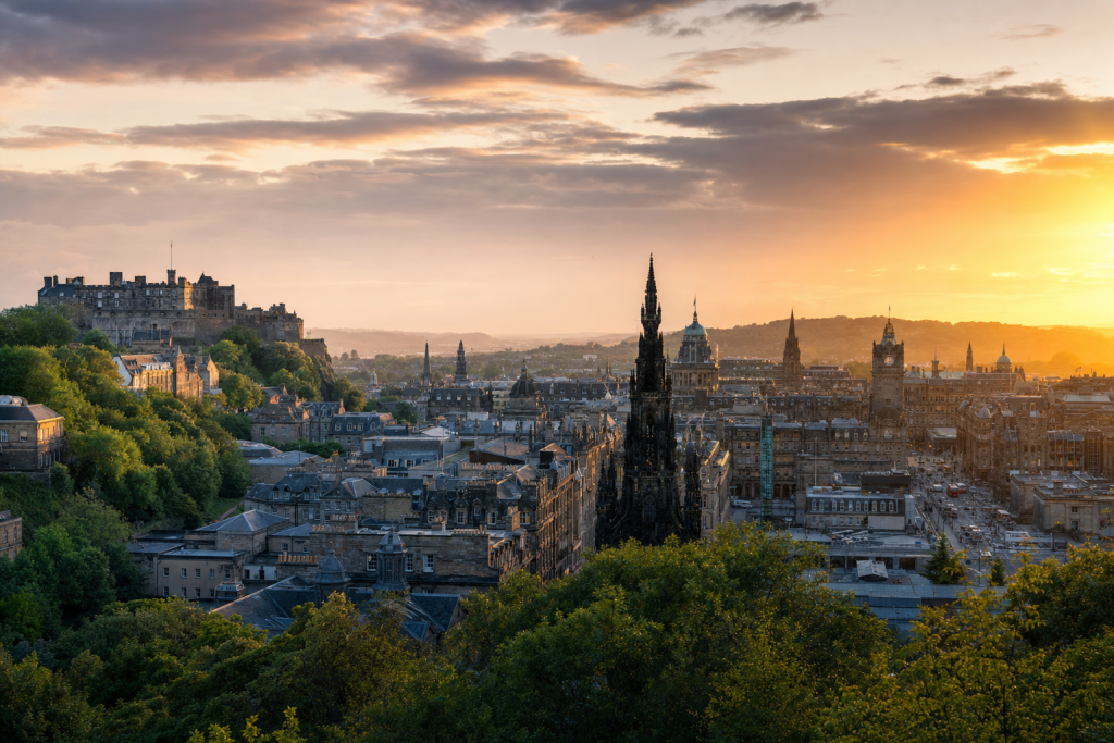 Edinburgh skyline at golden hour with iconic landmarks in warm light