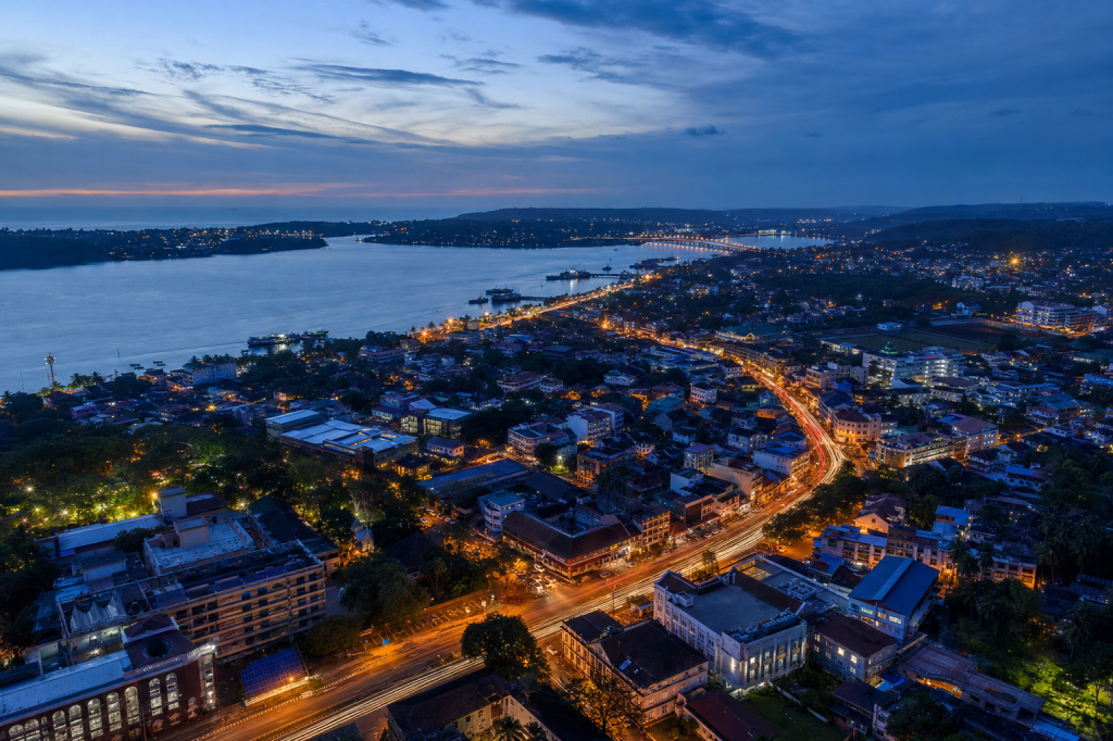 Goa high-vantage cityscape at blue hour with city lights and traffic motion