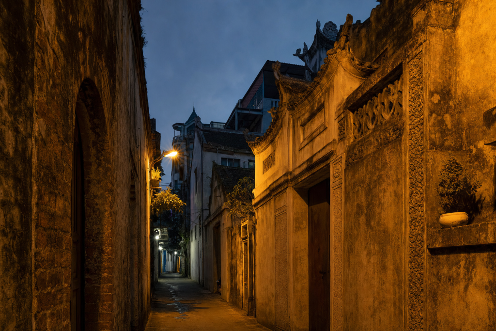 Hanoi street photography at blue hour with leading lines and architectural detail