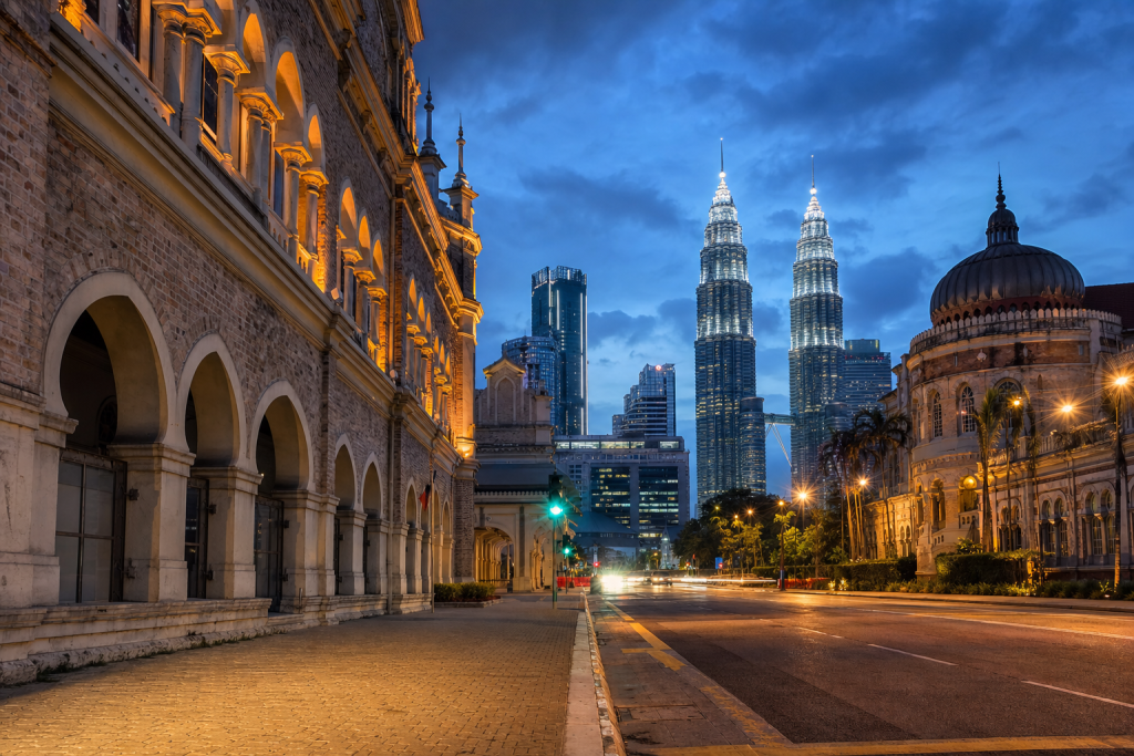 Street view in Kuala Lumpur, leading lines, architectural detail, blue hour with mixed ambient and street lighti