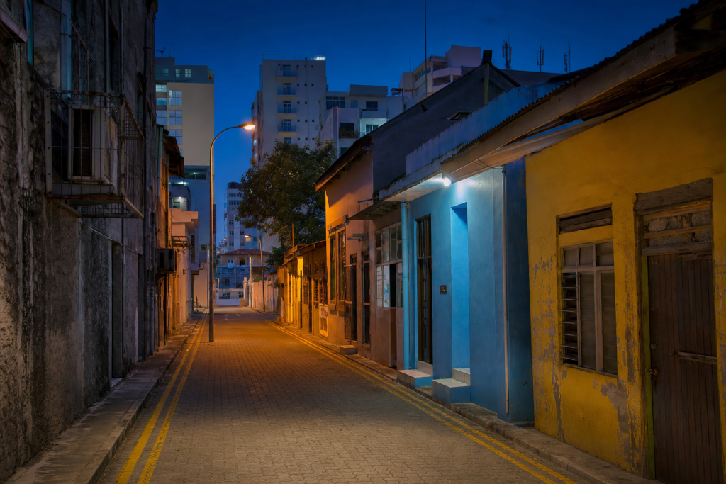 Male street photography at blue hour with leading lines and architectural detail