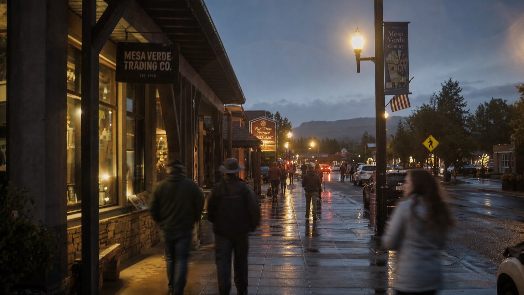 Blue hour street photography in Mesa Verde with wet pavement reflections and warm storefront lighting