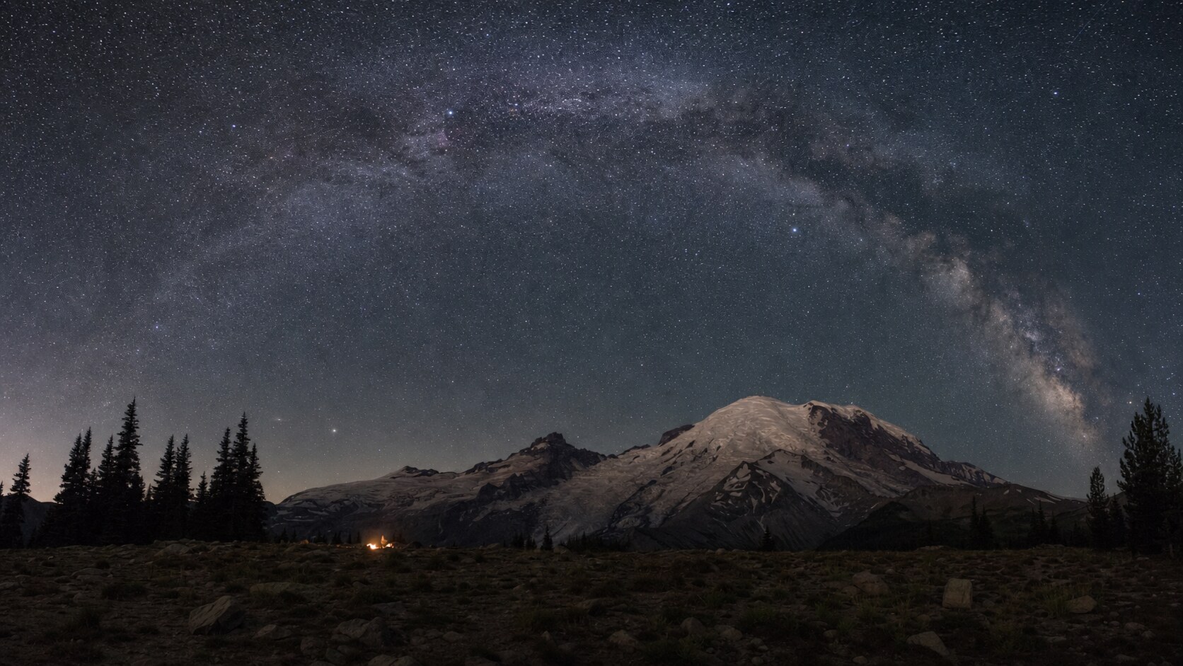 Milky Way and night sky over the iconic landmark of Mount Rainier National Park — a classic astrophotography composition for the park