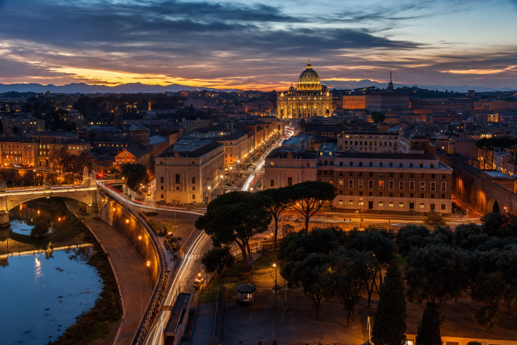 Rome high-vantage cityscape at blue hour with city lights and traffic motion
