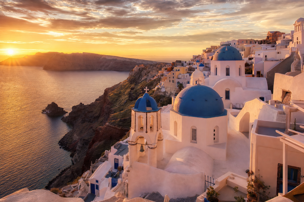 Santorini skyline at golden hour with iconic landmarks in warm light