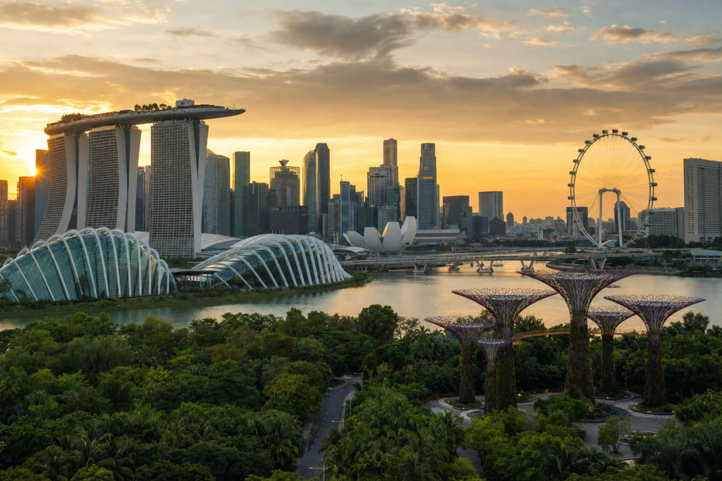 Singapore skyline at golden hour with iconic landmarks in warm light
