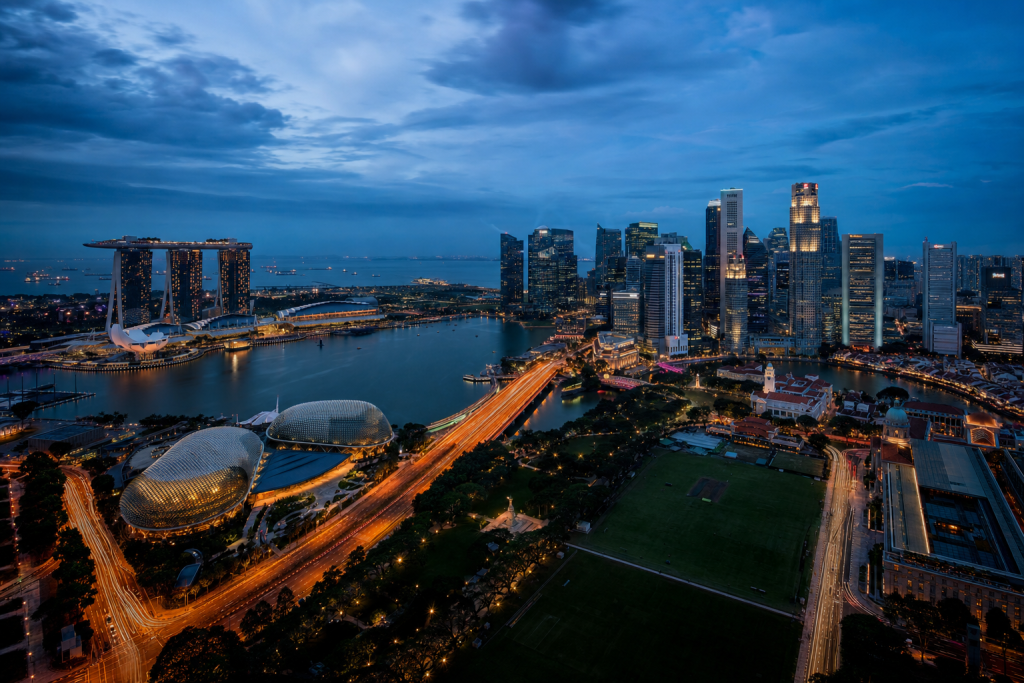Singapore high-vantage cityscape at blue hour with city lights and traffic motion