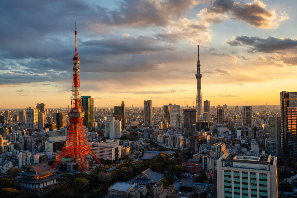 Tokyo skyline at golden hour with iconic landmarks in warm light