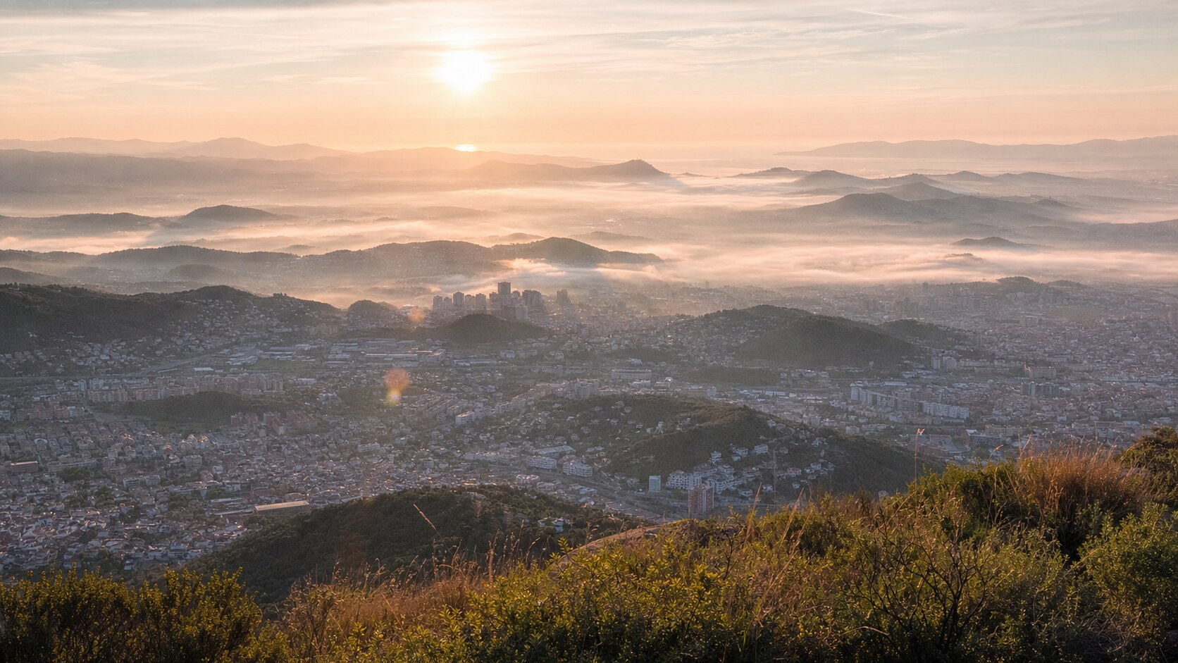 Sunrise aerial-style view of Barcelona, the signature opening shot most photography tours begin with