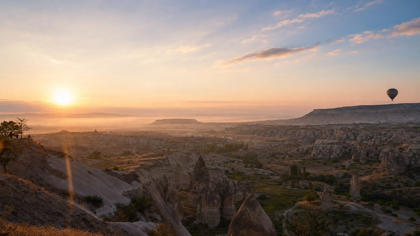 Sunrise aerial-style view of Cappadocia, the signature opening shot most photography tours begin with